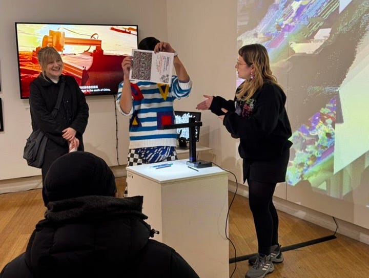 young people and families taking part in making robots out of cardboard boxes