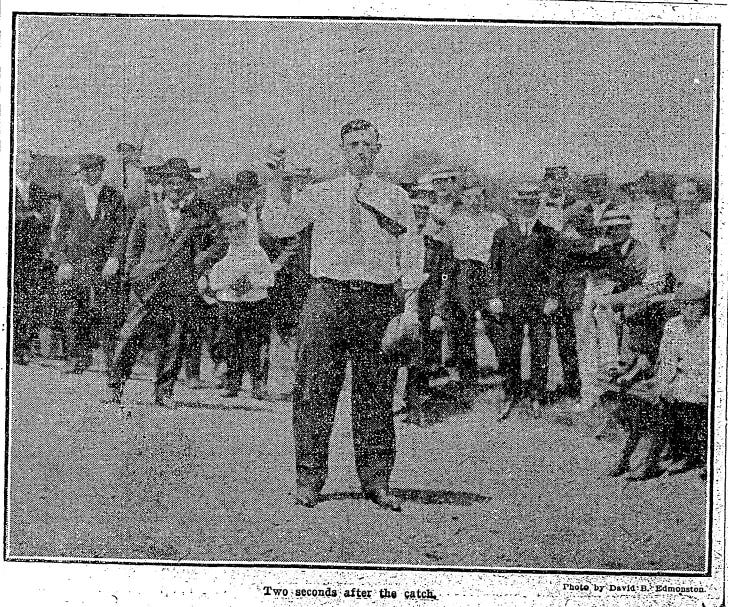 Street holds up the ball he caught in front of an excited crowd.