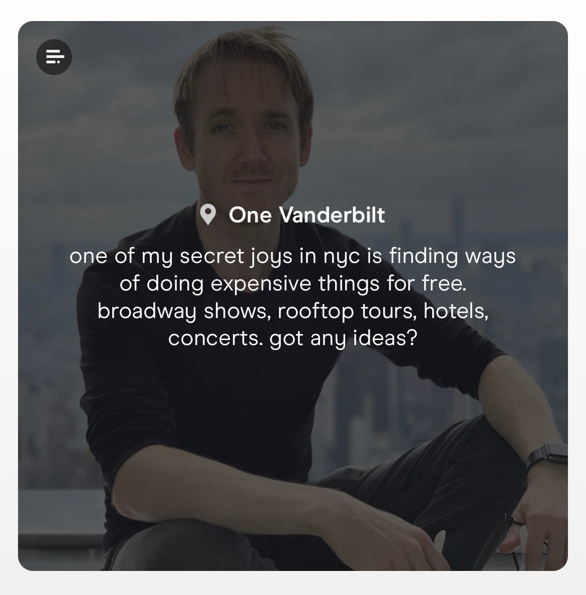 screenshot of a captioned photo of dating consultant steve dean in which he sits by the window of a new york city skyscraper with the city skyline in the background