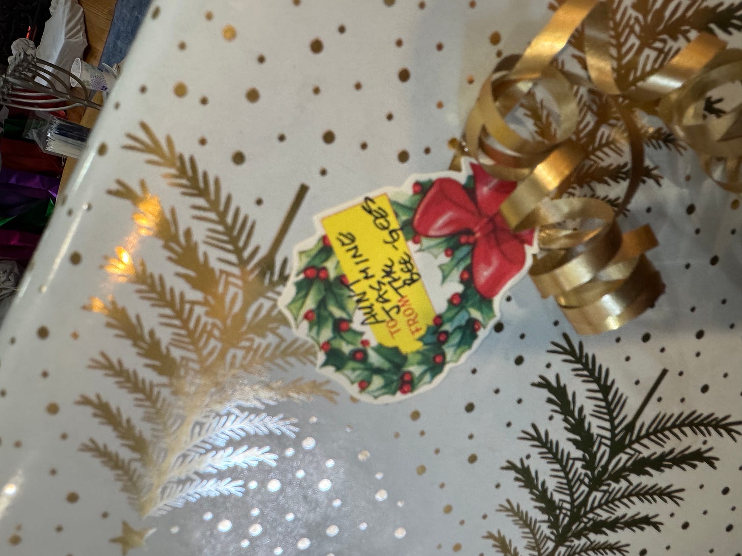 close-up of gift sticker on wrapped Christmas present