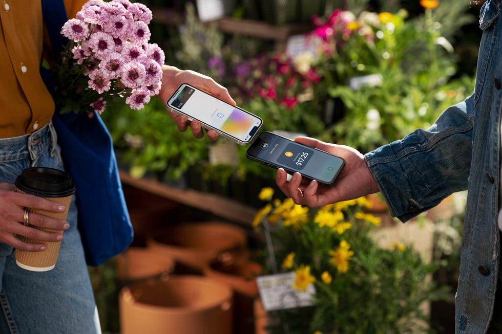 A customer uses Tay to Pay on iPhone to purchase produce at the farmer’s market. A customer uses Tay to Pay on iPhone to purchase produce at the farmer’s market.