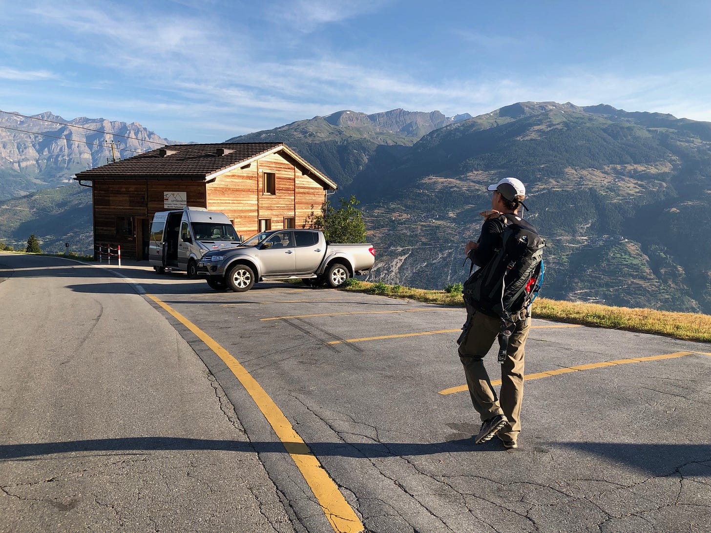 The van waits for passengers to arrive from the valley (from Leuk?) on the cablecar.