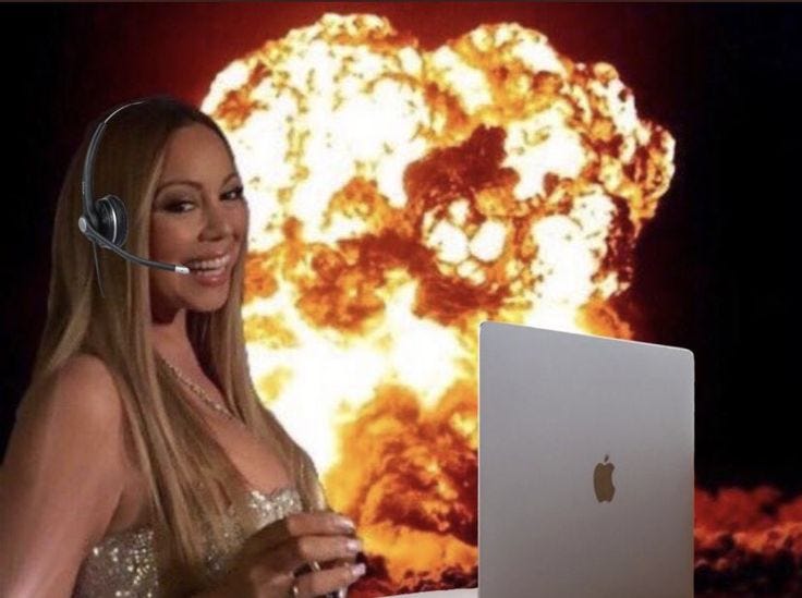 This may contain: a woman with headphones on is looking at a laptop screen and has an explosion in the background