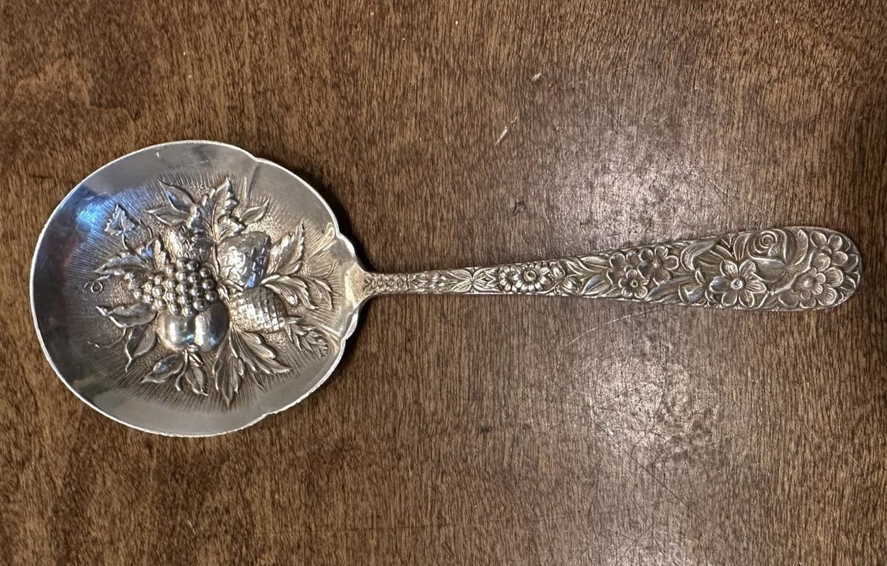 Fruit-ornamented spoon.