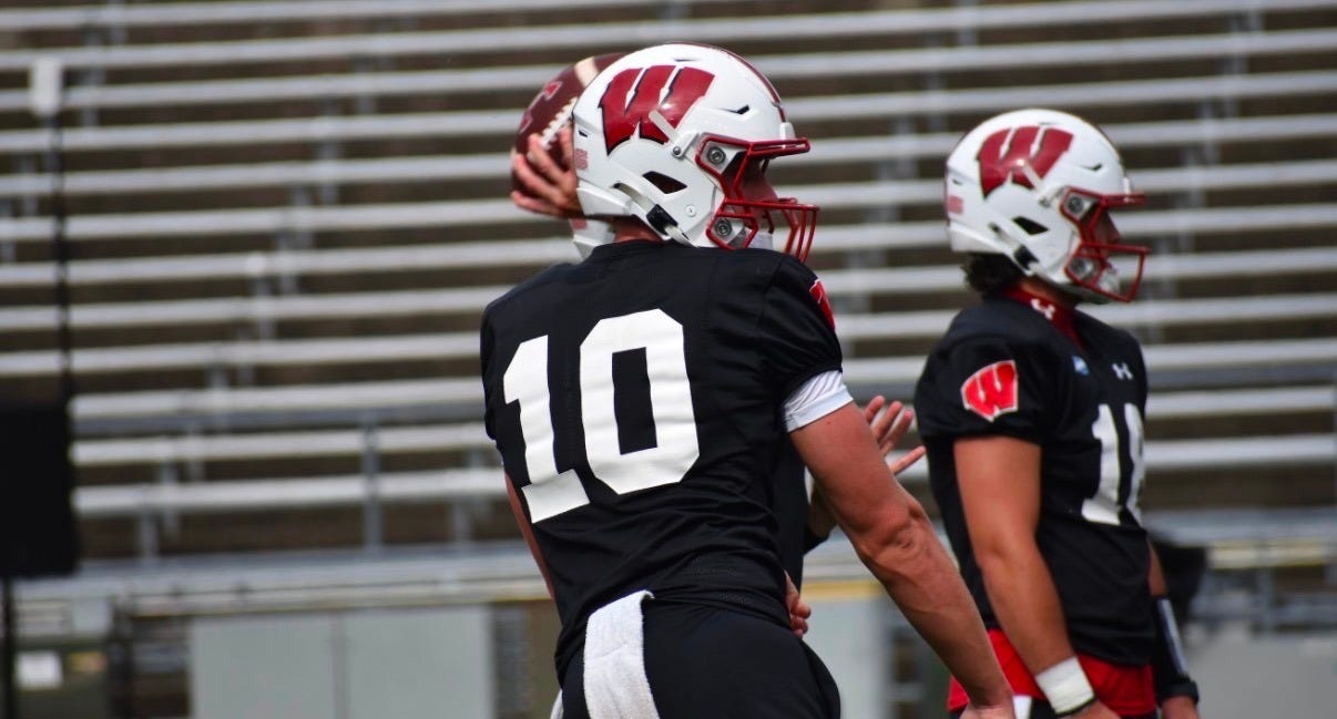 Wisconsin Badgers quarterback Ryan Hopkins throws a pass during a fall camp practice.