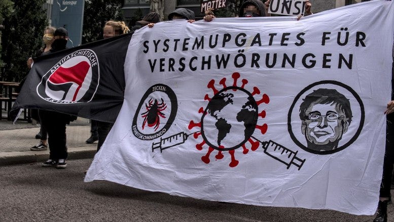 Protestors holding banners in the Anarchist Covid Protest