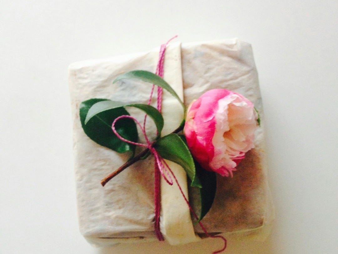 white and pink floral textile