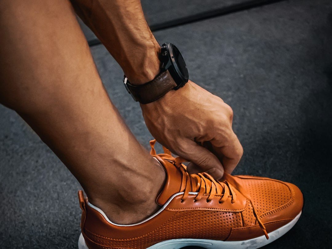 person wearing orange nike sneakers person wearing orange nike sneakers