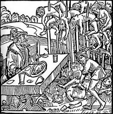 A bearded man wearing a hat sits at a table with plate and cups on it; he watches a man cutting corpses into pieces; in the background, there are dozens of stakes with corpses on them A bearded man wearing a hat sits at a table with plate and cups on it; he watches a man cutting corpses into pieces; in the background, there are dozens of stakes with corpses on them