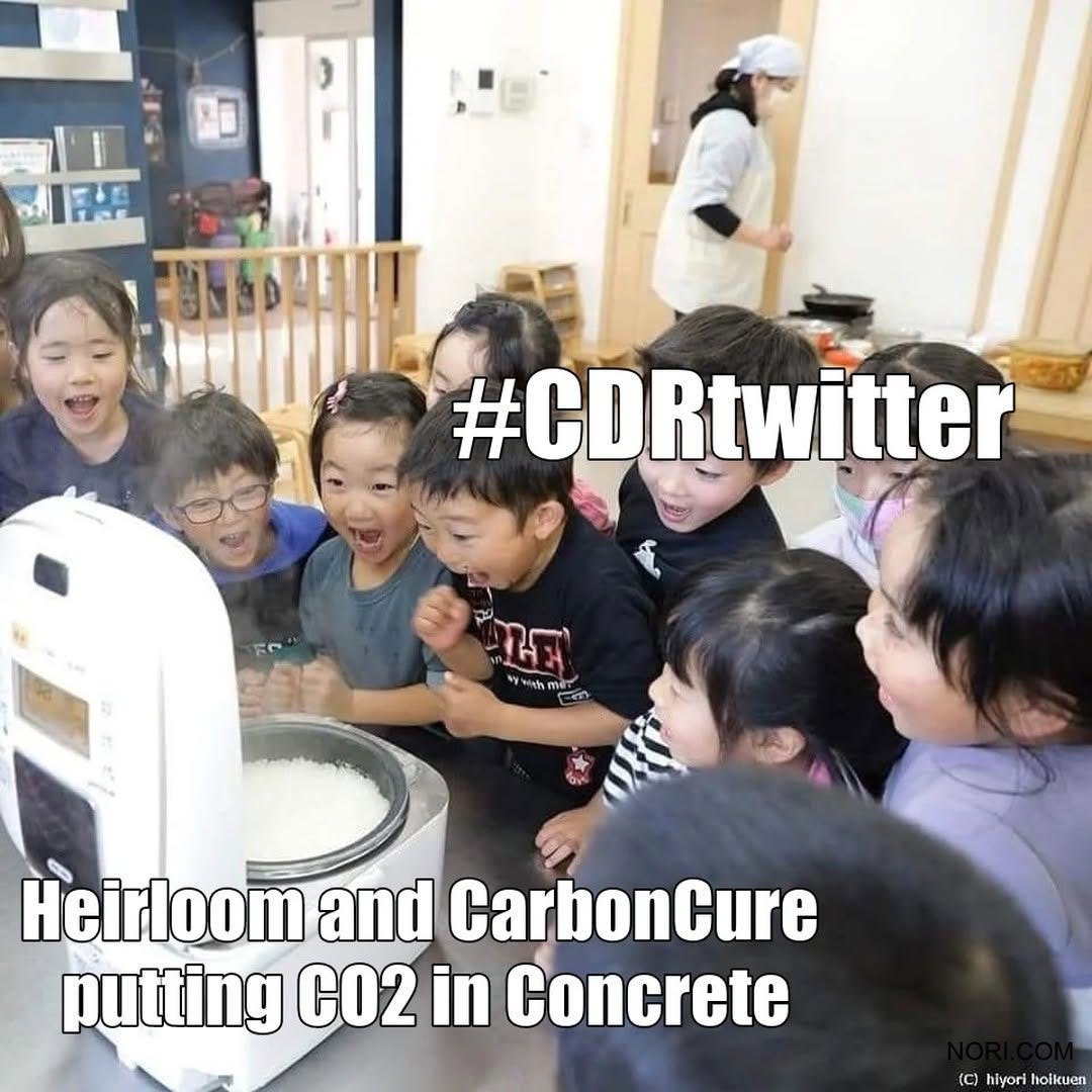 Photo of a crowd of excited children peering into a rice cooker, labelled "#CDRtwitter", with the cooker labelled "Heirloom and CarbonCure putting CO2 in concrete".