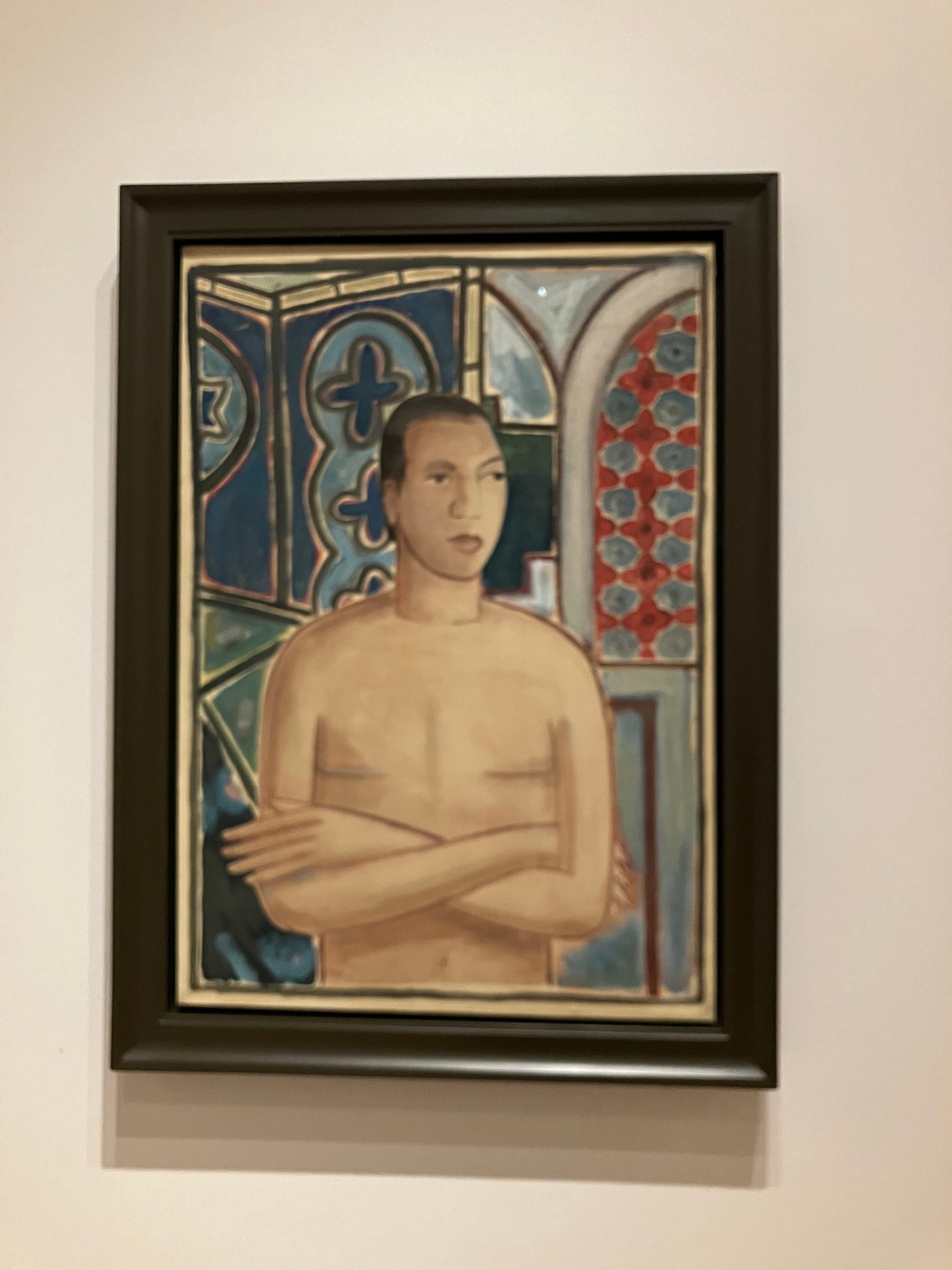 half portrait of a naked man with crossed arms against a blue abstract background half portrait of a naked man with crossed arms against a blue abstract background