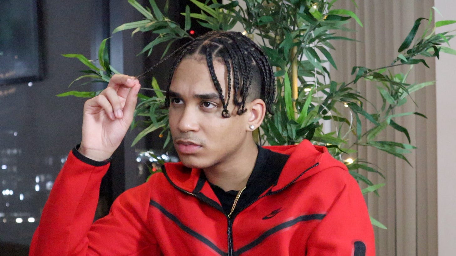 Joshua Arthur in a red tracksuit during a filmed interview, London, April 2021. Joshua Arthur in a red tracksuit during a filmed interview, London, April 2021.