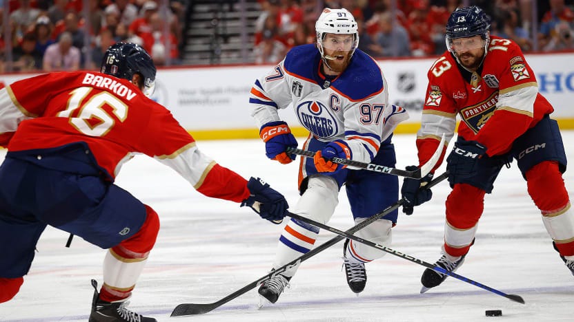 McDavid tries to navigate through the NZ McDavid tries to navigate through the NZ
