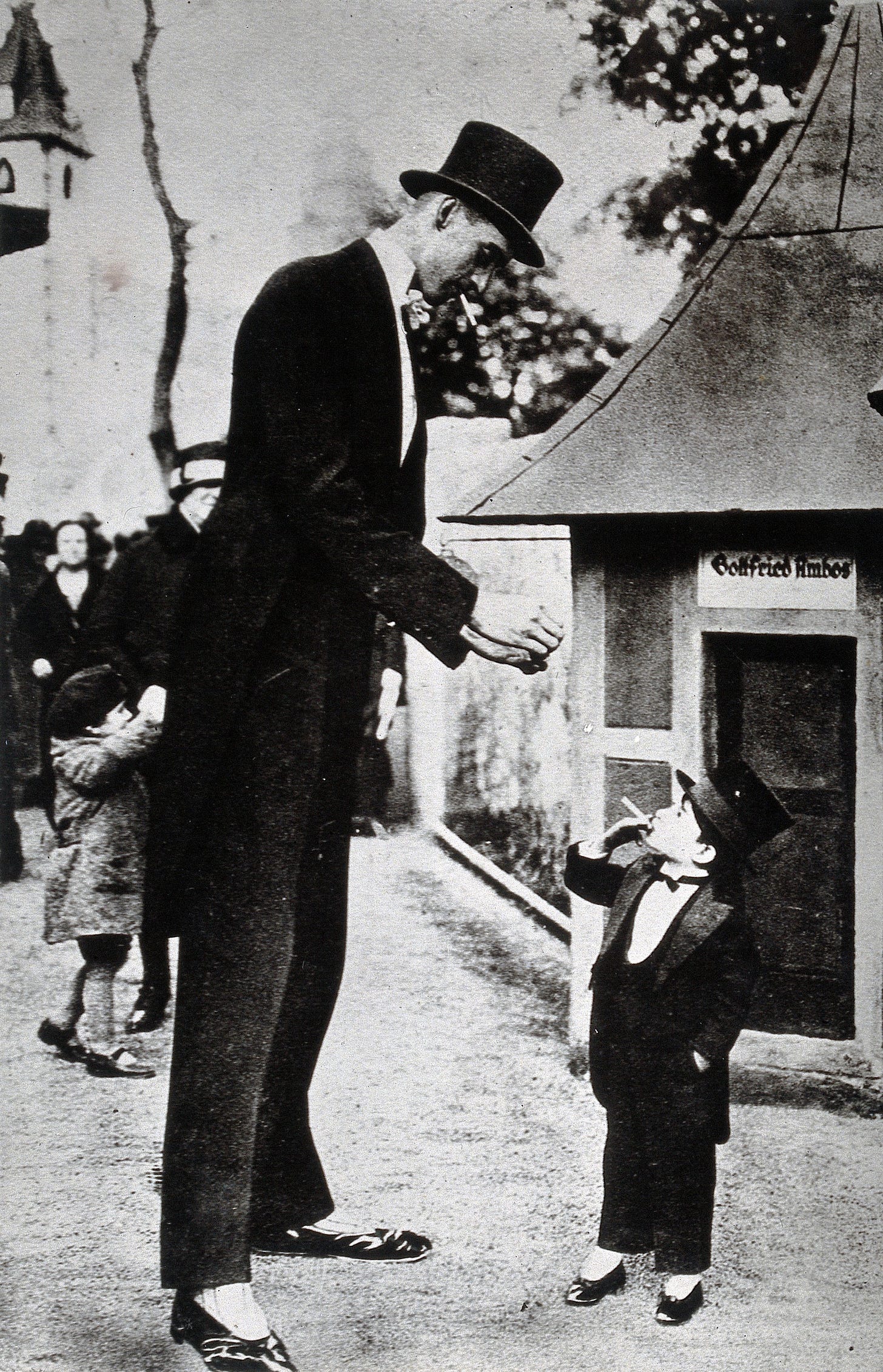 File:An abnormally tall and an abnormally small man; the former a ...