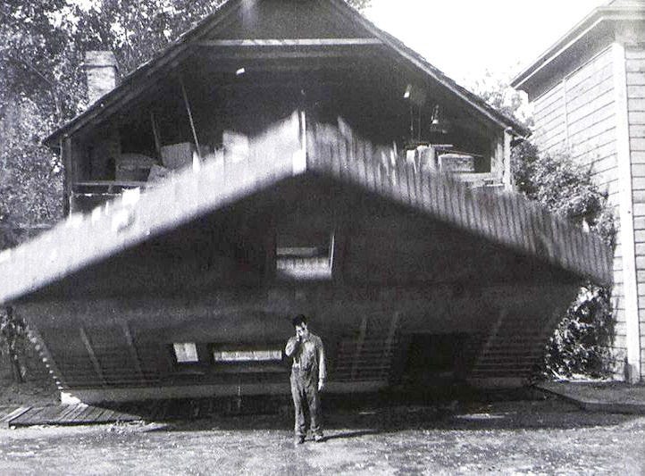 House falling on Buster Keaton standing in window