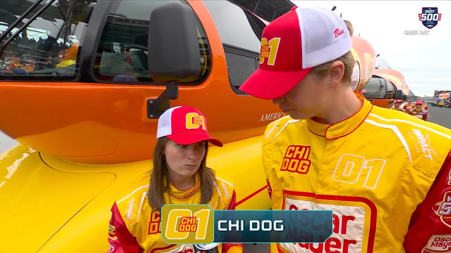 The Chi Dog team in front of their Wienermobile The Chi Dog team in front of their Wienermobile