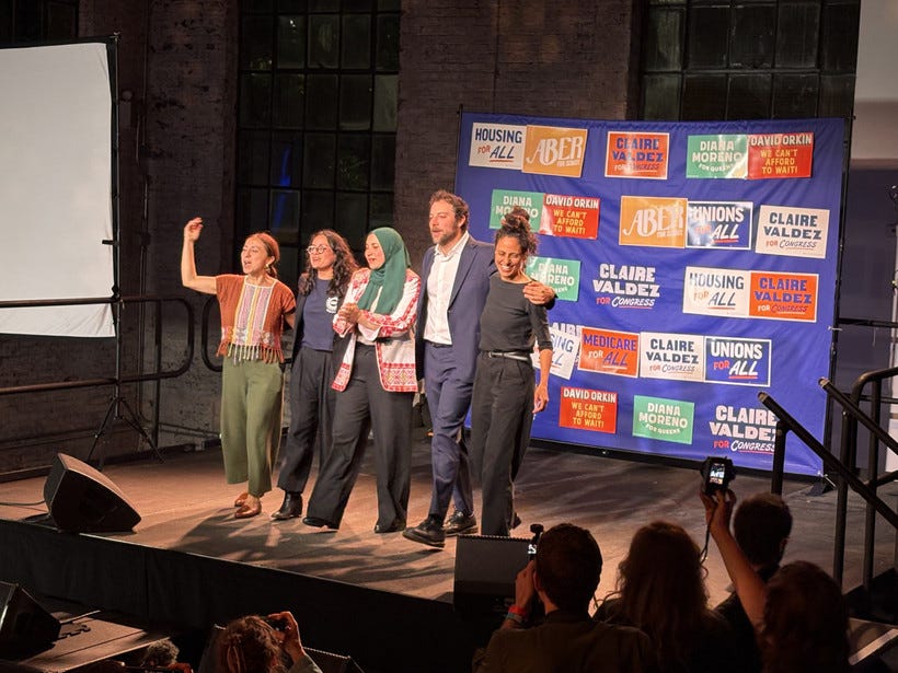Winning DSA candidates at a watch party