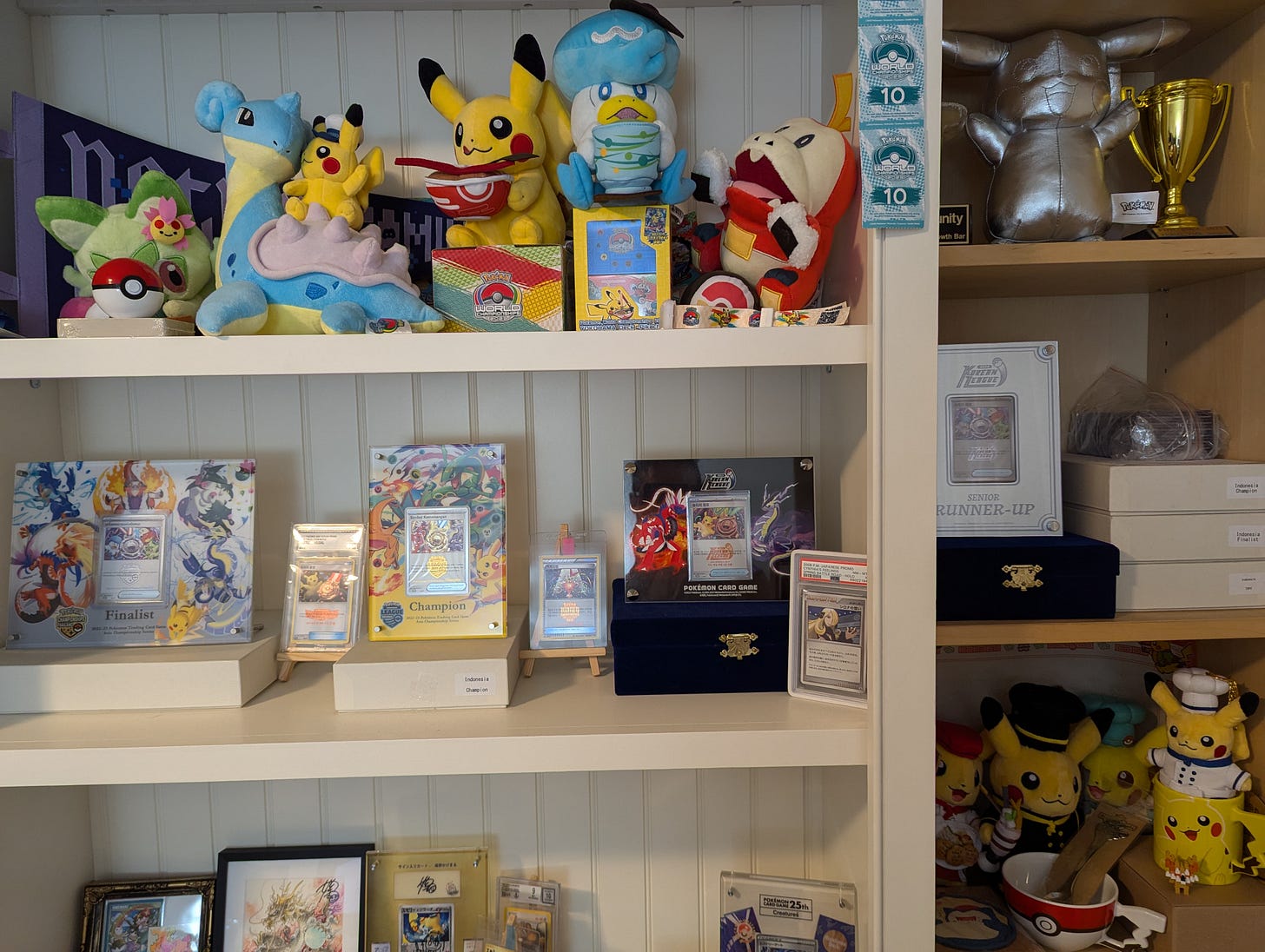 A photograph featuring Emory's collection of trophy cards he has purchased