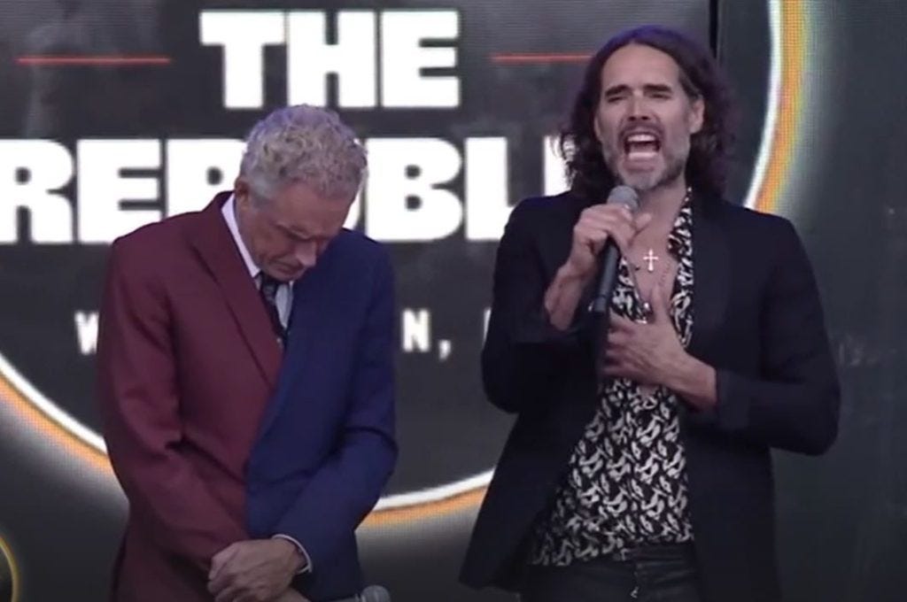 Jordan Peterson and Russell Brand on stage