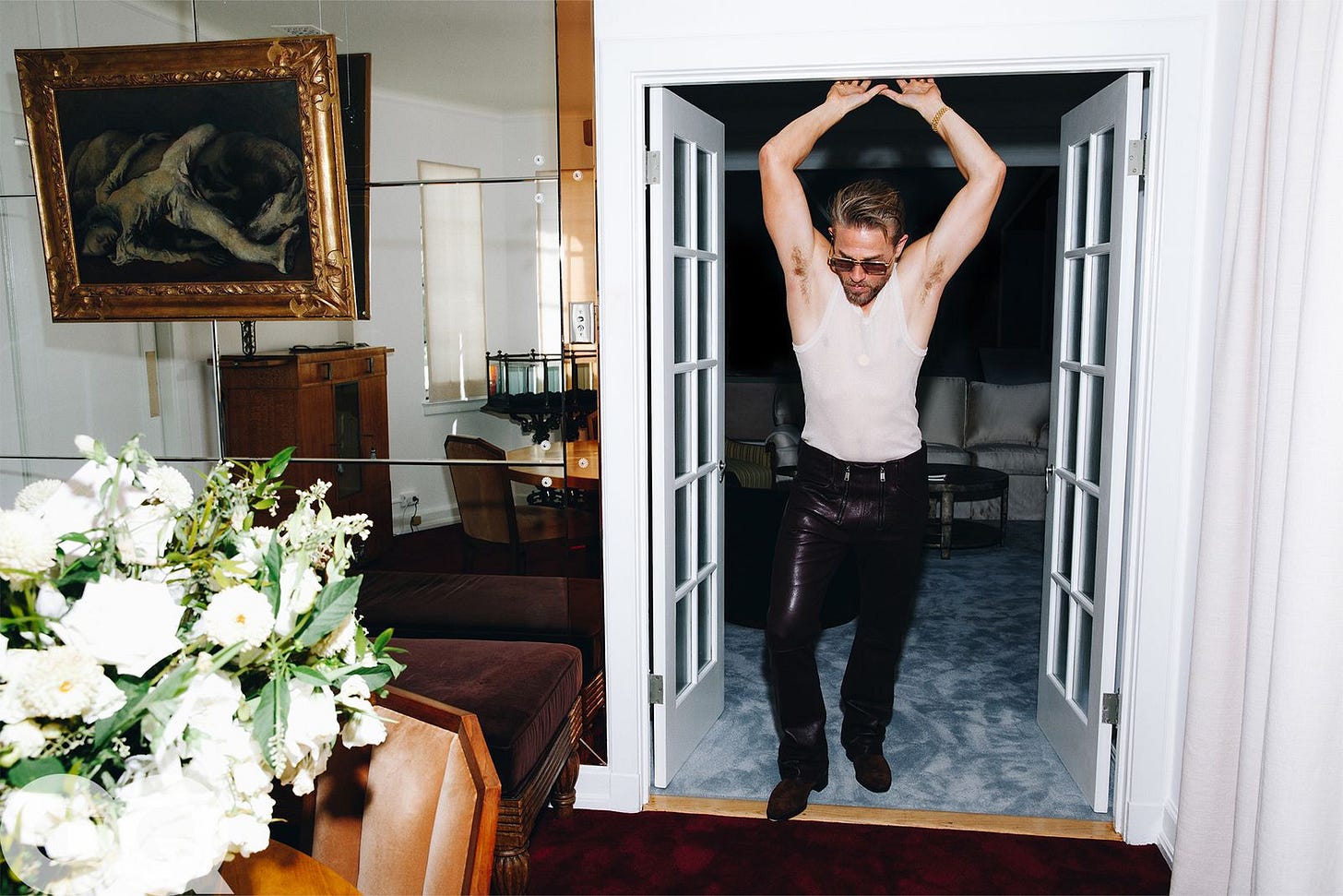 Tank top by Louis Vuitton Men's. Pants by Enfants Riches Deprimes. Boots  by John Lobb. Sunglasses  by Jaques Marie Mage.