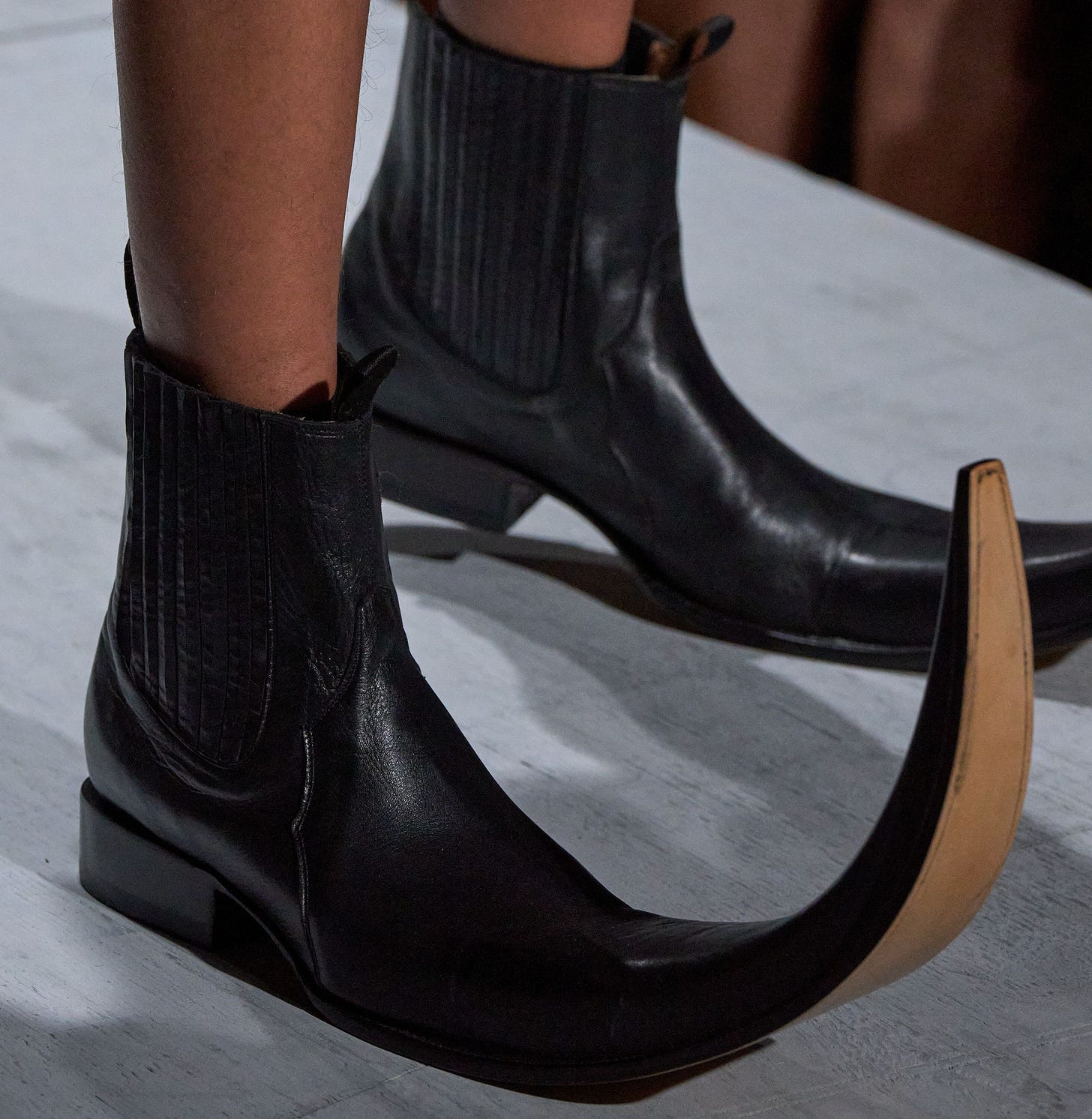 Image may contain Clothing Footwear Shoe High Heel Person and Boot Image may contain Clothing Footwear Shoe High Heel Person and Boot