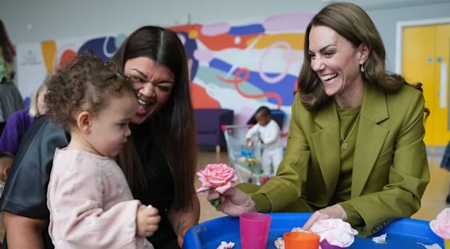 Princess Catherine smiling with a parent and a toddler