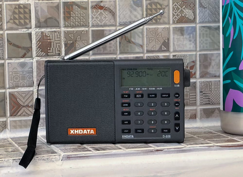 mt radio sitting on the edge of the bath