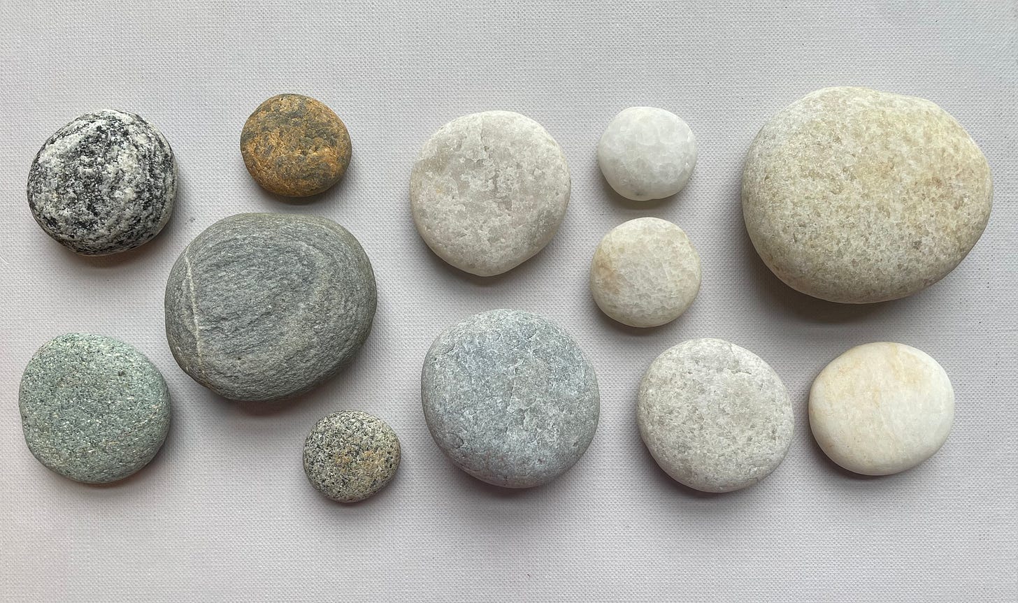 Rock portrait of round rocks on a grey background