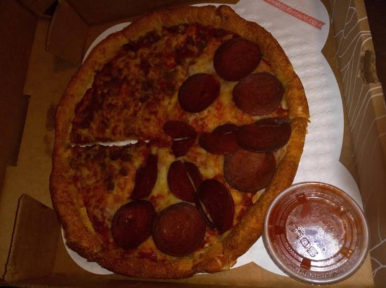 Field Roast vegan pepperoni and Beyond Meat vegan sausage on cheese pizza.