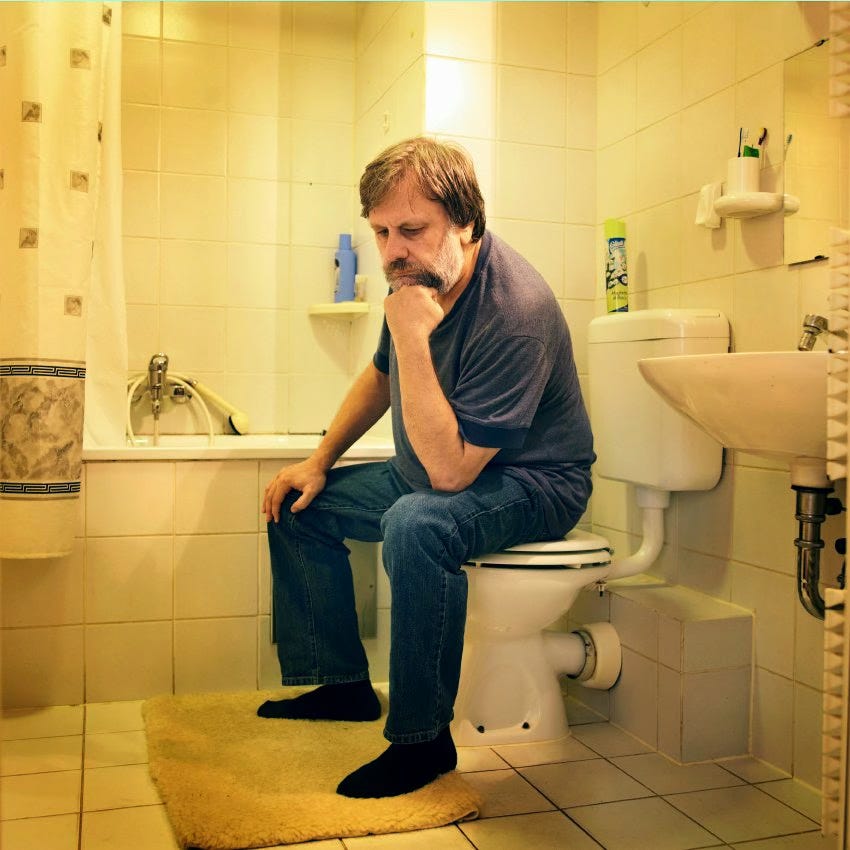 Slavoj Žižek sitting on a toilet in the thinking pose Slavoj Žižek sitting on a toilet in the thinking pose