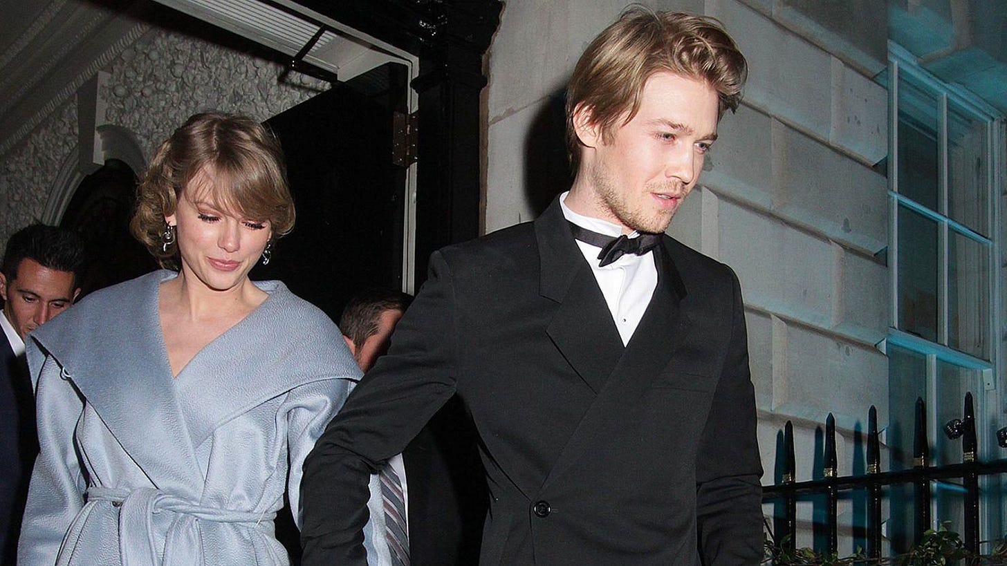 Taylor Swift (left) and Joe Alwyn attend a British Vogue Fashion and Film BAFTA party in London in February 2019.