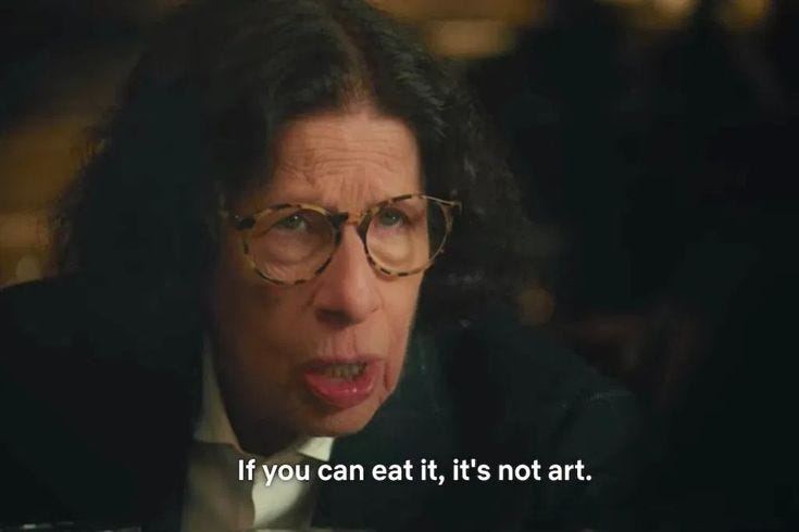 This may contain: a woman with glasses making a funny face in the movie if you can eat it, it's not art