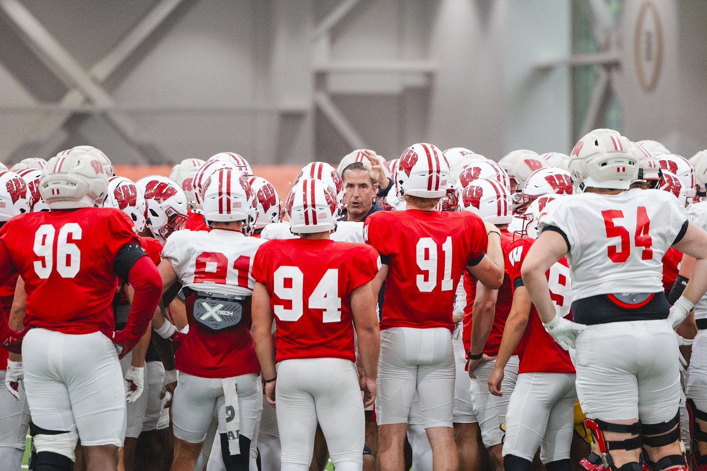 Wisconsin Badgers head coach Luke Fickell addresses the team during an indoor practice.