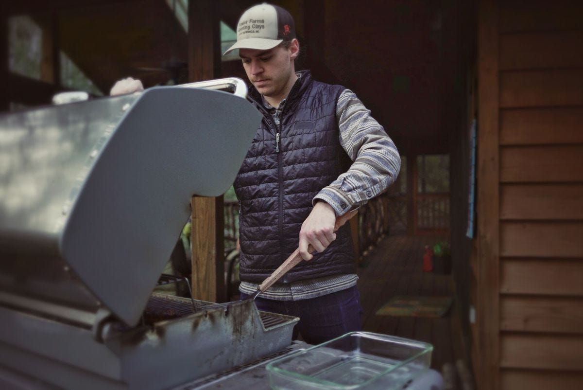 ryan wears a patagonia nano puff vest while grilling steaks ryan wears a patagonia nano puff vest while grilling steaks
