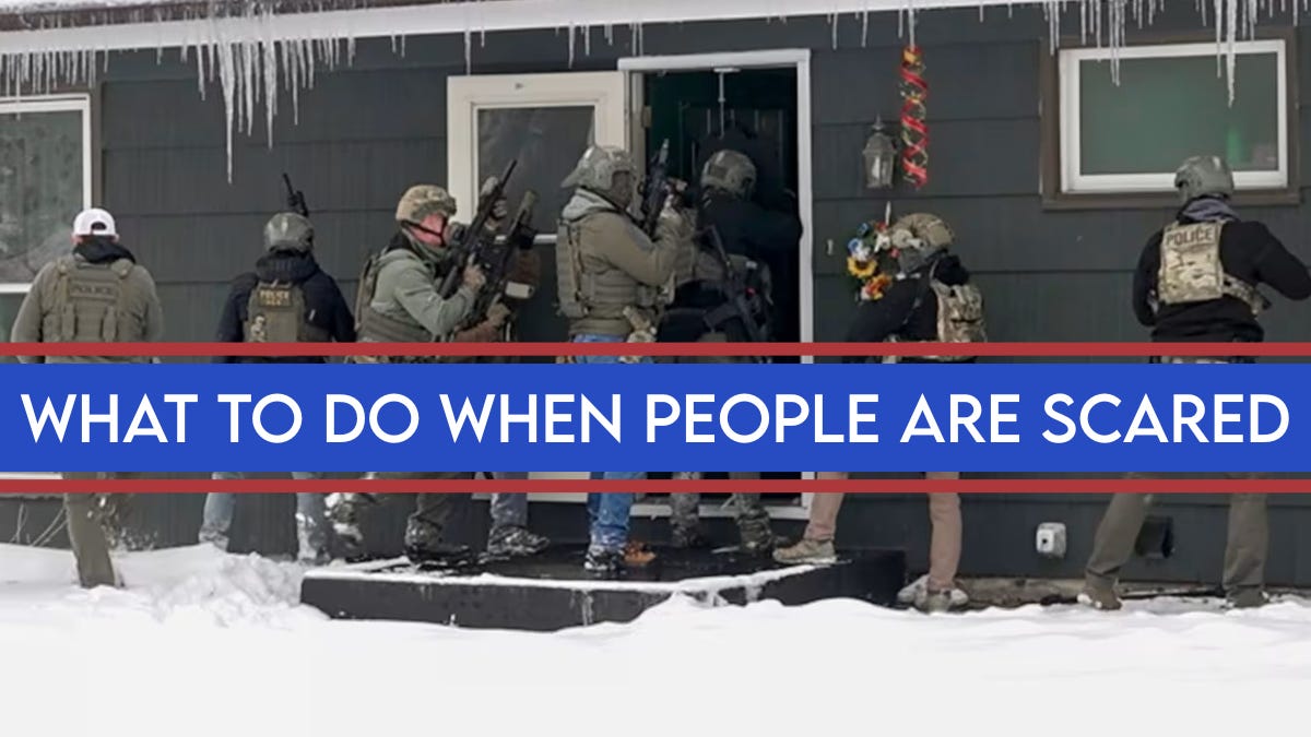 Armed tactical officers outside a home with the headline ‘What to do when people are scared,’ illustrating a community safety and local capacity guide