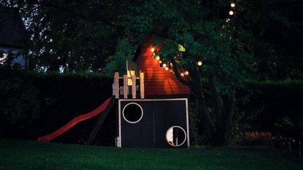 Blue and Red Wooden Play Yard at Night Time Blue and Red Wooden Play Yard at Night Time
