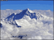 an aerial view of a snow covered mountain surrounded by clouds an aerial view of a snow covered mountain surrounded by clouds