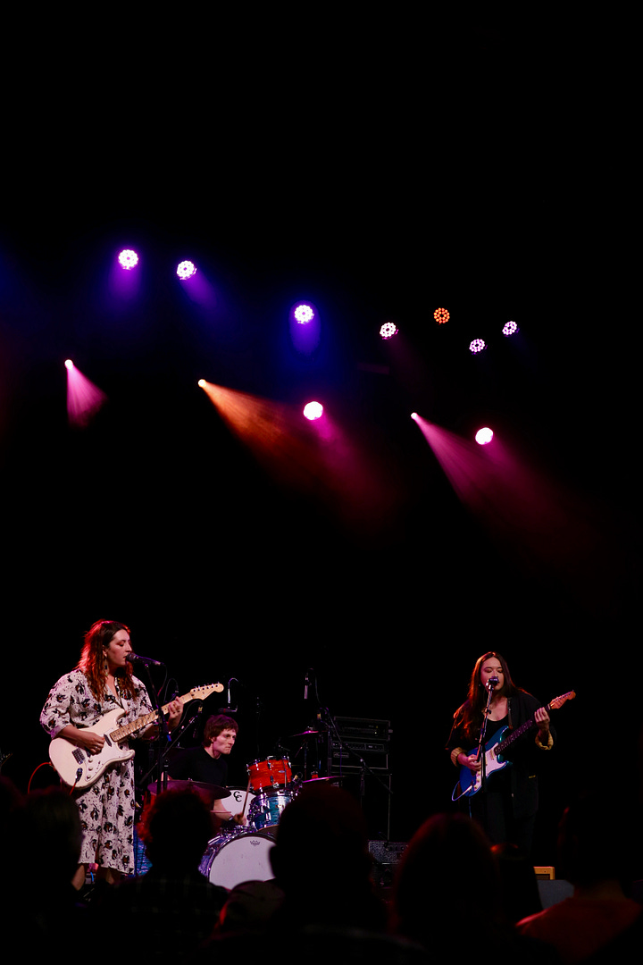 Finom performs under colorful lights