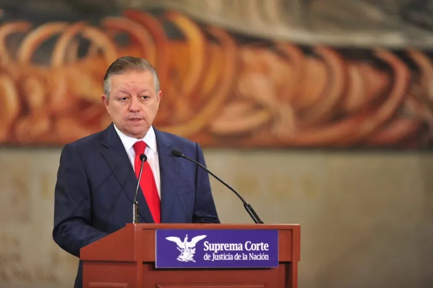 Arturo Zaldivar standing at a podium