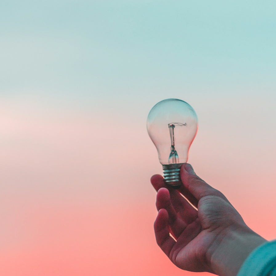 person holding light bulb