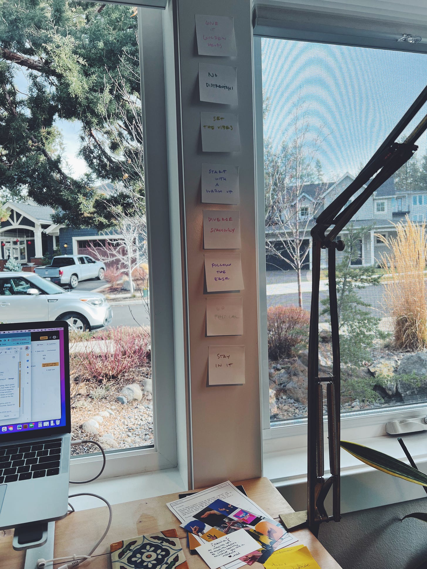 Photo of stickies up on wall between windows