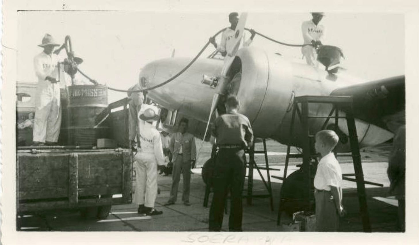 Ground crew refueling Amelia Earhart’s plane in Surabaya with Fred Noonan, her flight navigator Ground crew refueling Amelia Earhart’s plane in Surabaya with Fred Noonan, her flight navigator