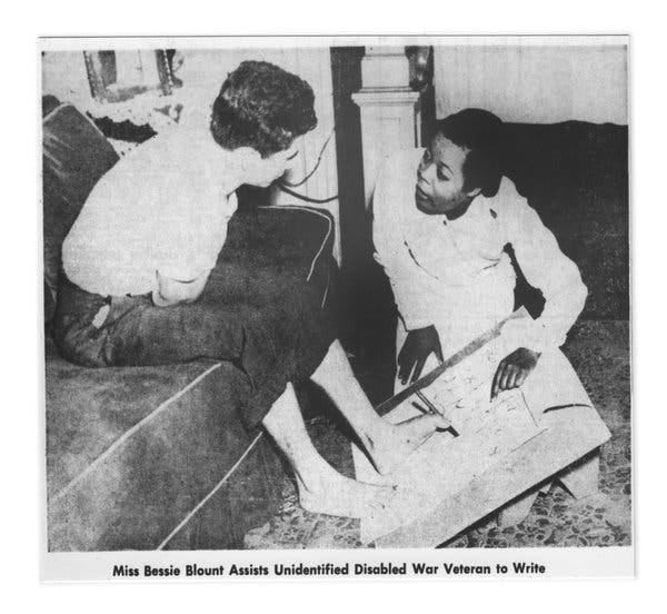 Bessie Blount in 1958 helping a disabled war veteran write with his feet. She later invented a feeding device to help veterans become self-sufficient.
