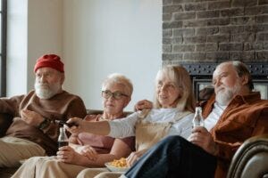 friends on couch with snacks