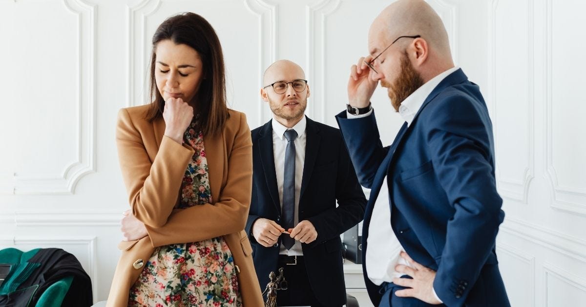 A Frustrated Couple with their divorce lawyer A Frustrated Couple with their divorce lawyer