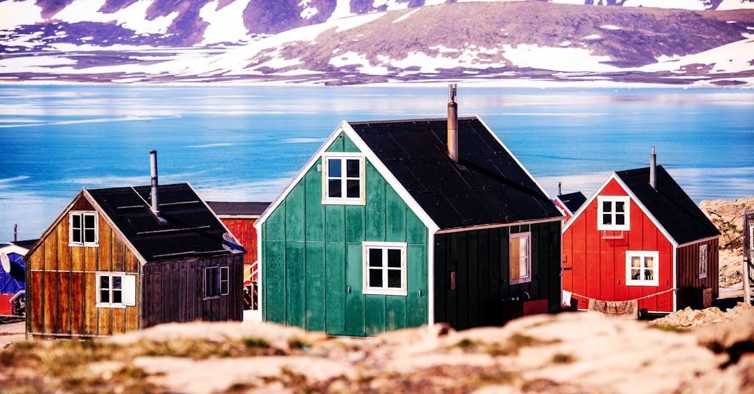 a group of small houses sitting on top of a rocky hillside