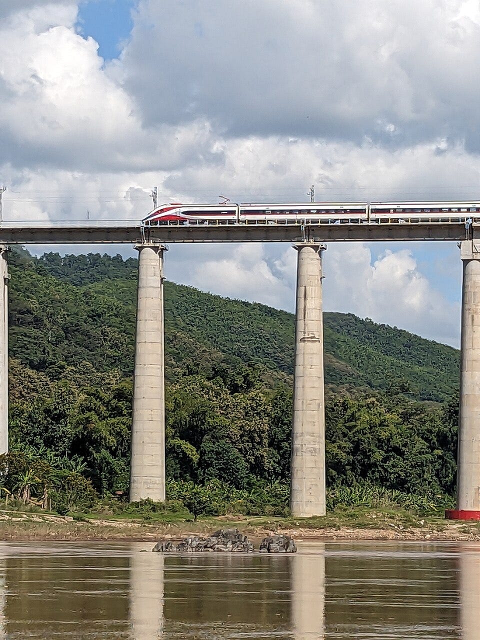Laos–China Railway train crossing the Mekong River near Luang Prabang as regional trade and passenger traffic reach record levels. Laos–China Railway train crossing the Mekong River near Luang Prabang as regional trade and passenger traffic reach record levels.