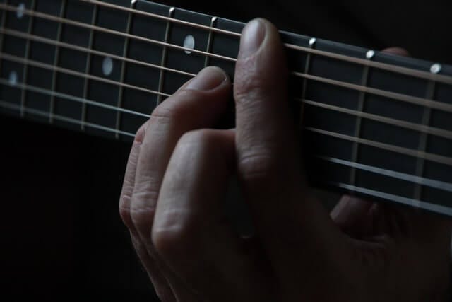 person using guitar photo person using guitar photo