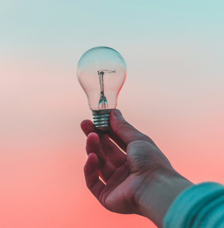 person holding light bulb
