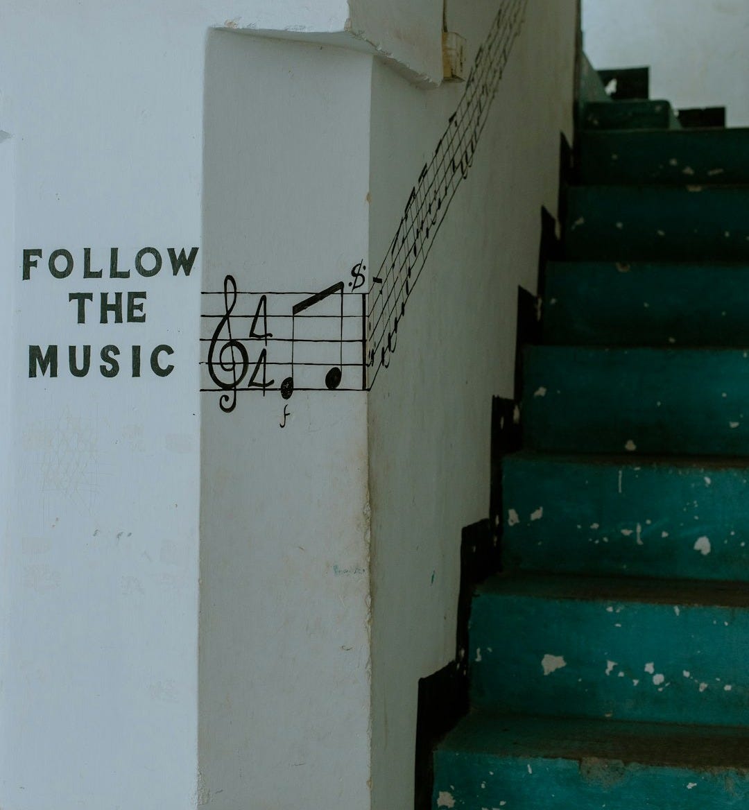 a set of stairs with a musical note painted on it a set of stairs with a musical note painted on it